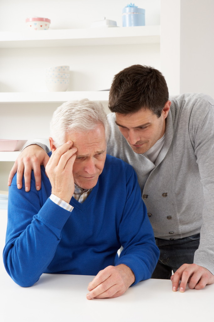 Younger Man Consoling Older Man